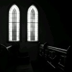 Stained glass windows and pew